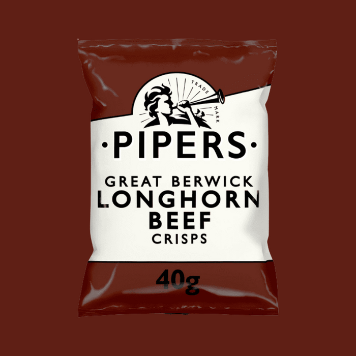A close-up of crisps with a piece of dry-aged beef in the background.