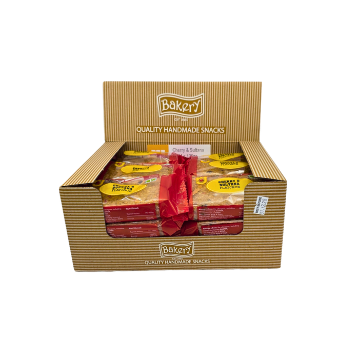 Unwrapped RJ Cherry & Sultana Flapjack Bar showing cherries and sultanas in oat base