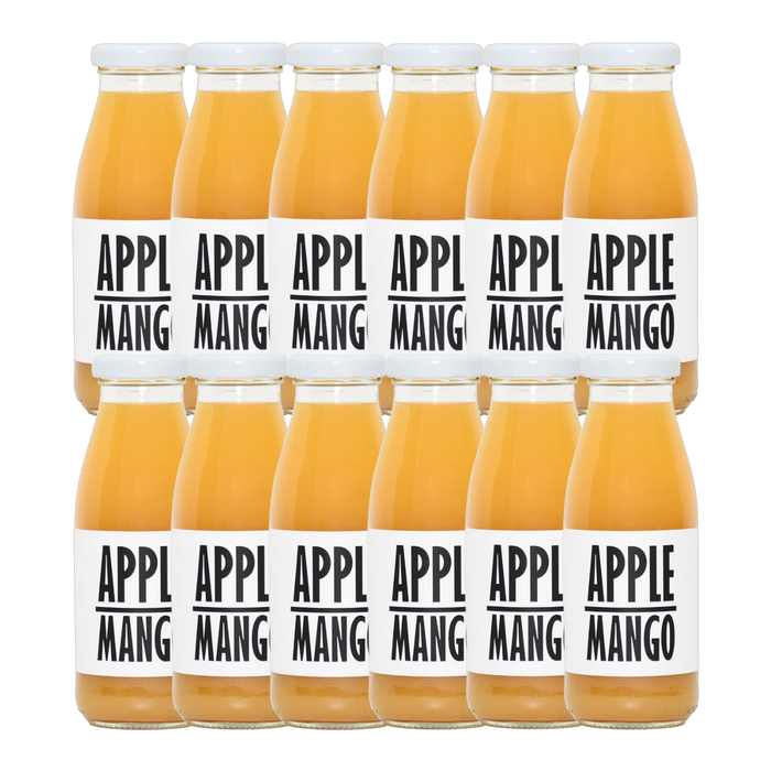 A bottle of Pressuice Apple-Mango Juice with fresh apples and mangoes beside it.