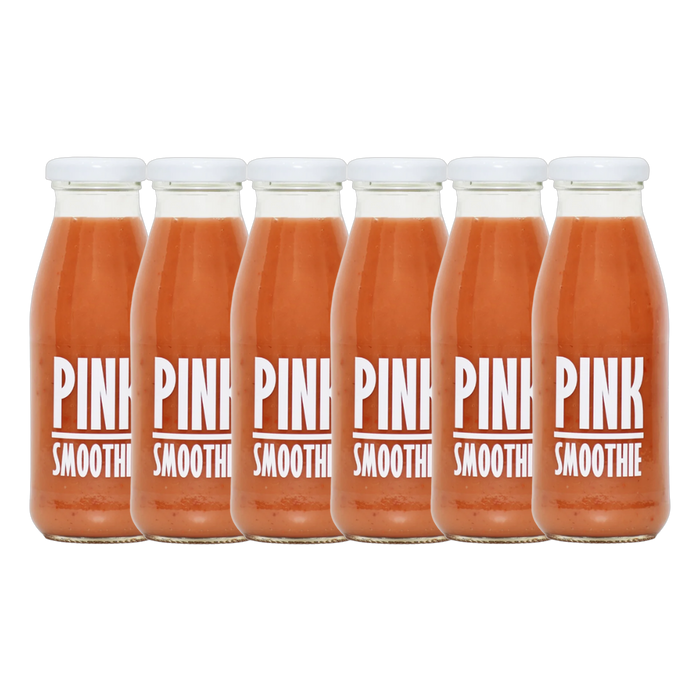 A bottle of Pressuice Pink Smoothie alongside fresh strawberries, raspberries, and bananas.