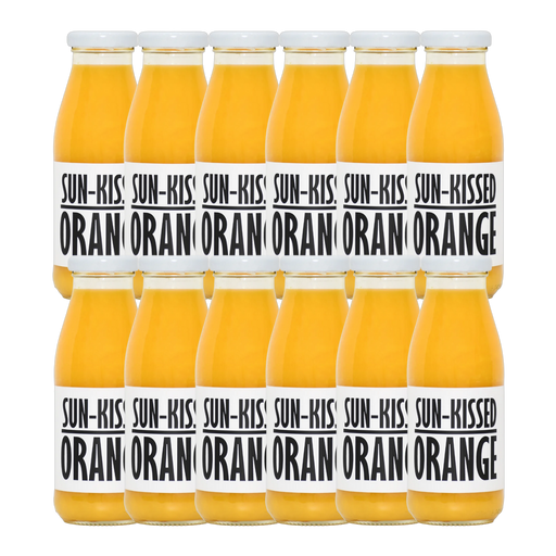 A bottle of Pressuice Sun-Kissed Orange Juice with fresh oranges in the background.