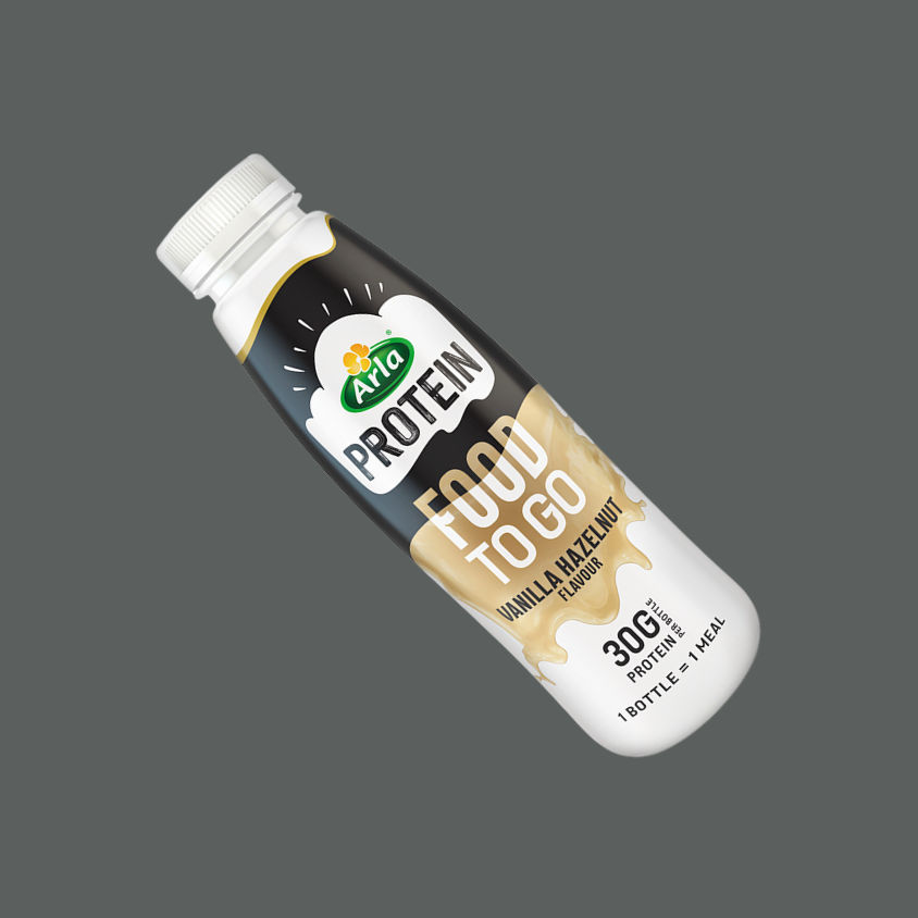 A close-up of the Arla Protein drink, showing smooth texture and creamy consistency.