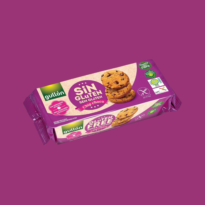Gullon cookies displayed beside a coffee cup on a wooden table