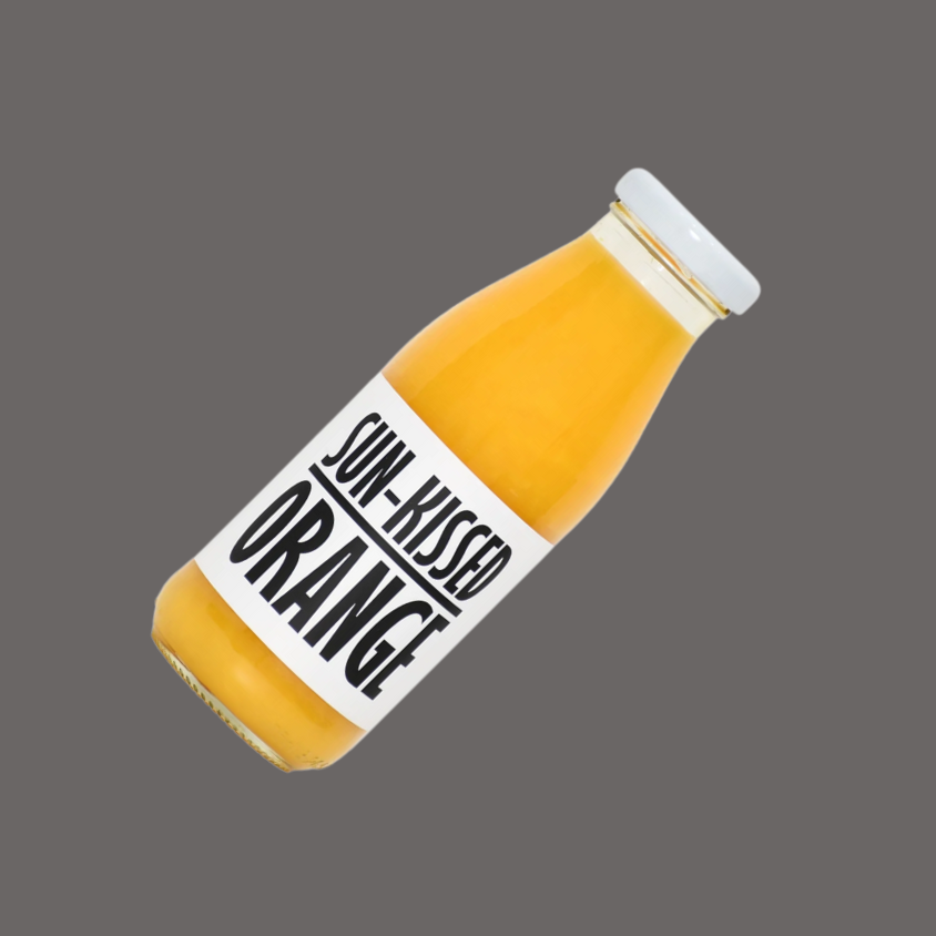 A glass of freshly poured orange juice, showcasing its rich color and natural cloudiness.