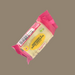 Hand holding a raspberry & white chocolate flapjack over a gym towel