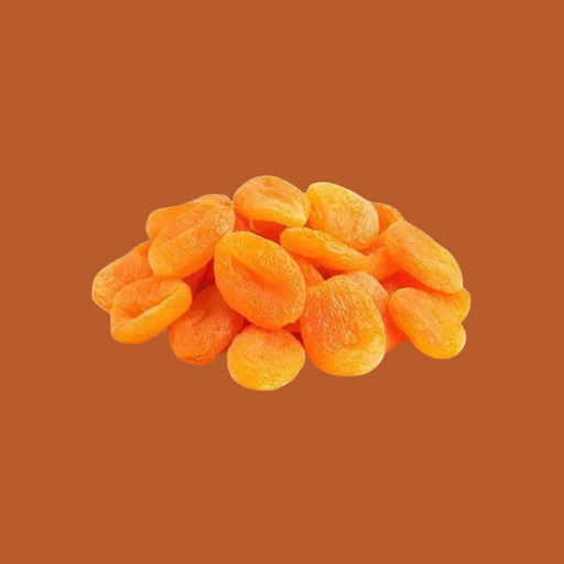 Pile of dried apricots on a brown background