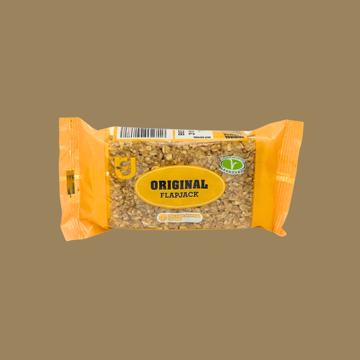 Row of 24 individually wrapped Original flapjacks on a wooden board