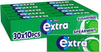 Bulk box of Extra Spearmint gum — 30 packs of 10 pieces each; bright green wrappers with white "Extra" logo and mint-leaf illustration