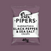 A close-up of crisps with fresh Tellicherry peppercorns and sea salt in the background.