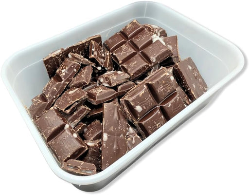 1kg tub of broken chocolate mint pieces — irregular chocolate shards and mint-filled chunks in a plastic tub, ideal for baking and confectionery.