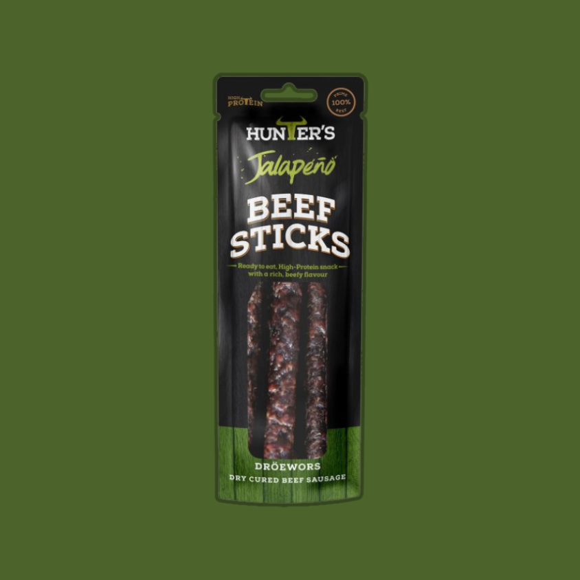 Pack of Hunters Jalapeño Beef Sticks on a rustic wooden table.