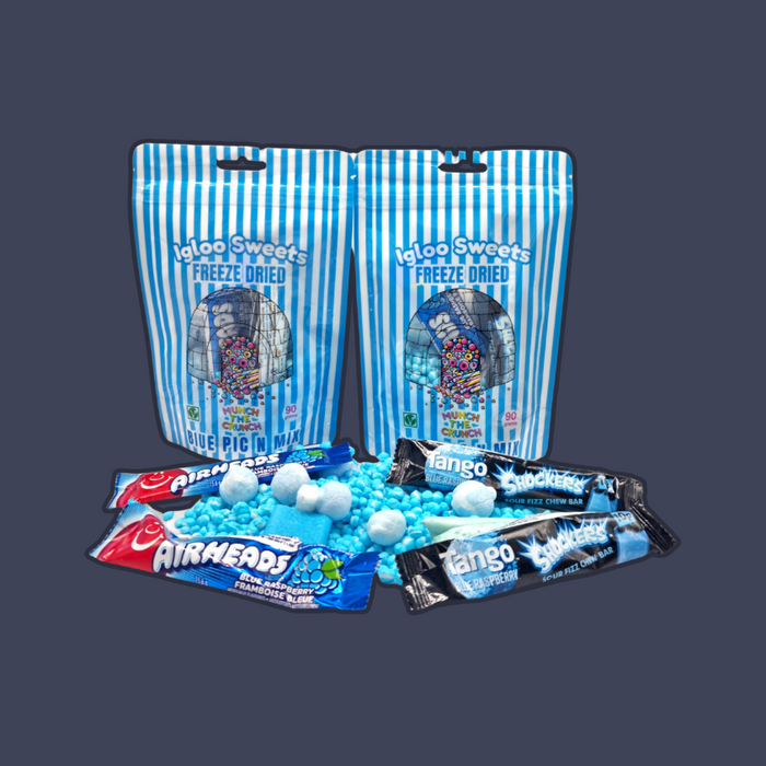 Hand holding a handful of crunchy Blue Raspberry Freeze Dried Candy