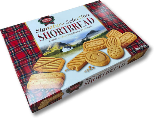 Assorted Scottish shortbread fingers, rounds, and cookies arranged on a plate