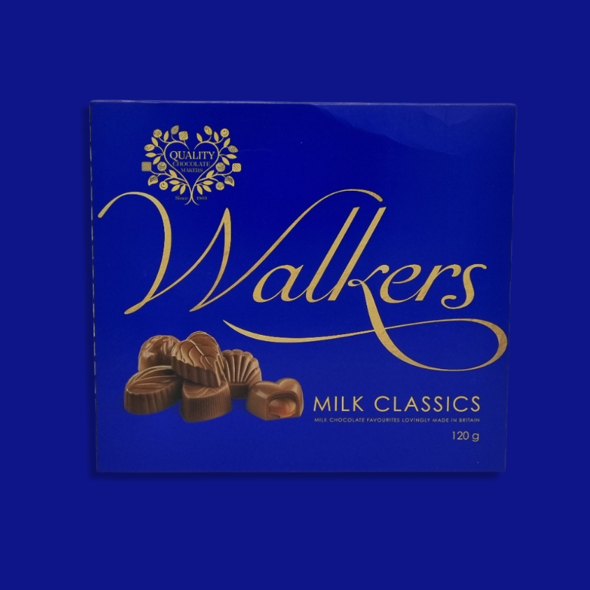 Open box of Walkers milk chocolates showcasing a variety of smooth and creamy pieces.