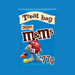 A bowl of M&M's Crispy poured out of a treat bag, highlighting the crispy rice centers.