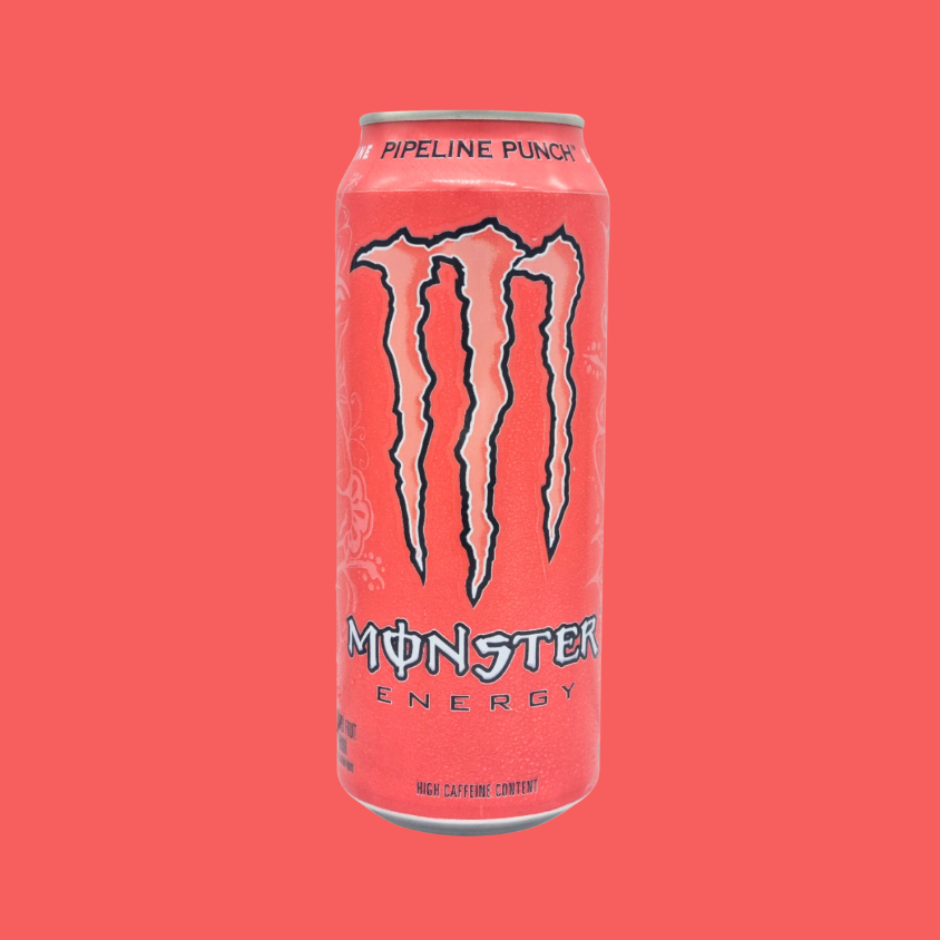 A 4-pack of Monster Pipeline Punch Energy Drinks on a beach-themed table.