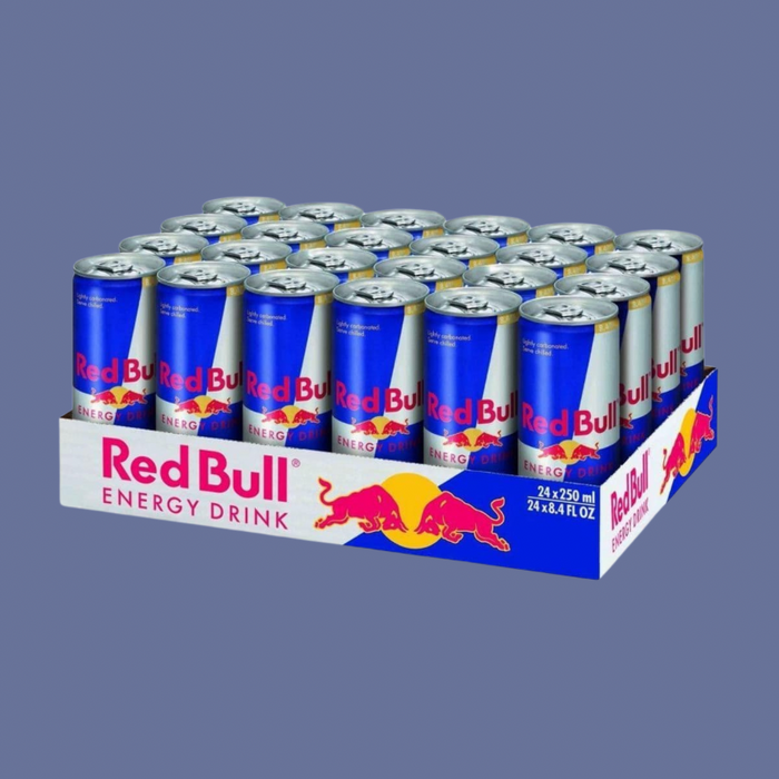 Close-up of Red Bull Original pouring into a glass