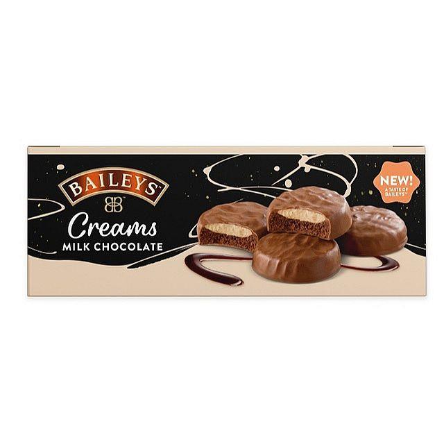 Seven 128g packs of Baileys Milk Chocolate Creams arranged together, each wrapper showing the Baileys logo and an image of milk chocolate pieces with a creamy center — 7 x 128g multipack.
