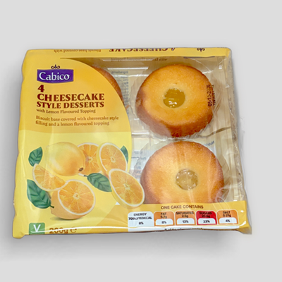 Cabico Lemon Cheesecake Dessert 200g — product image of a 200g tub of lemon-flavored cheesecake showing smooth pale-yellow creamy filling with a light biscuit crumb topping, labeled packaging visible for brand recognition.