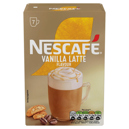 Single sachet of Nescafe Vanilla Latte next to a prepared cup of frothy latte