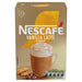 Single sachet of Nescafe Vanilla Latte next to a prepared cup of frothy latte