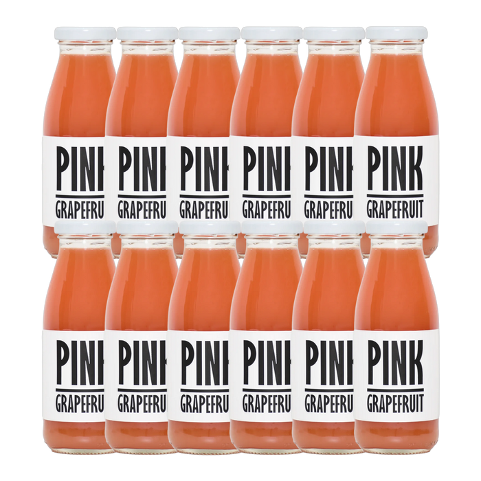 A bottle of Pressuice Pink Grapefruit Juice with fresh grapefruits in the background.