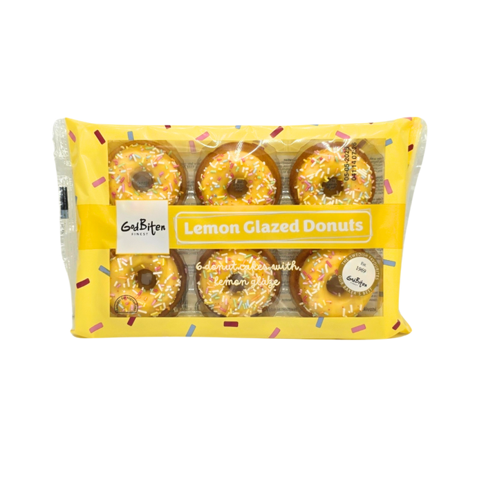 A close-up of a lemon-glazed mini doughnut with a glossy citrus glaze.