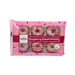 Close-up of a raspberry-glazed mini doughnut with a glossy, vibrant coating.